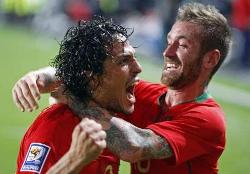 Bruno Alves of Portugal celebrate with Raul Mereiles after putting his country ahead against Bosnia Herzegovina