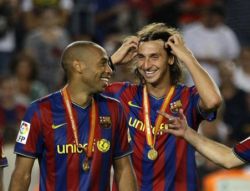 Thierry Henry and Zlatan Ibrahimovic with their medals after beating Athletic Bilbao in the Spanish Super Cup