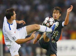 Real Madrid's captain Raul Gonzalez into a strong challenge against an FC Zurich defender