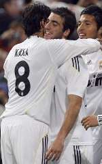 Ricardo Kaka congratulates Real Madrid's goal scorer Higuain. Ezekiel Garay also joins in celebration.