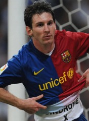 Lionel Messi of Barcelona celebrates in honor of Syndrome X victims after scoring against Real Madrid