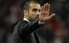 Pep Guardiola of Barcelona gesturing during his side's match against Real Madrid at the Camp Nou