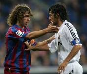 Barcelona's captain Carlos Puyol with Real Madrid's captain Raul during El Clasico