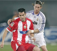 Real Madrid's Sergio Ramos challenges' an Almeria player during a La Liga encounter