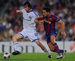 Artem Milevskiy of Dynamo Kiev battling for the ball against Xavi Hernandez of Barcelona between both side's game in the Champions League at the Camp Nou
