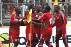 Malawi's national team players celebrate at the corner flag after scoring against Burkina Faso in the qualifiers