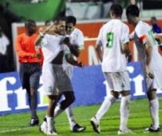 Algeria's players celebrate after scoring against Rwanda in the second round of the qualifiers