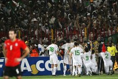 Algerian players celebrating in joy and over excitement in front of the fans