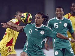 Nigeria's Peter Odimwinge battles it out during an African Cup of Nations game in Ghana.