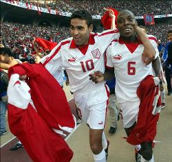 Tunisia's players run in joy and celebrations near the stands after winning the Africa Cup of Nations