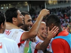 Tunisia's national team players express a happy mood after scoring a crucial goal.