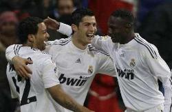 Marcelo on the left, Cristiano Ronaldo in the middle, and Mahamadou Diarra on the right, celebrate as Real Madrid hit 5 in their 6-0 thrashing of Real Zaragoza