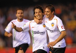 Valencia's David Silva and Joaquin celebrate during a La Liga match