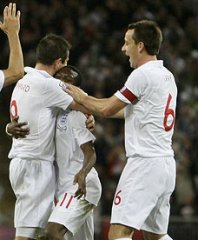 John Terry and Frank Lampard join in Sean Wright-Philipps' celebrations as England take the lead