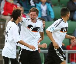 Germany's players celebrate after scoring against
Finland.