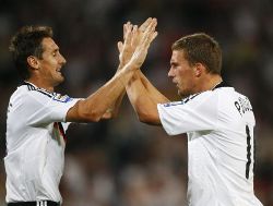 Germany's Miroslav Klose and Lucas Podolski celebrating
together.
