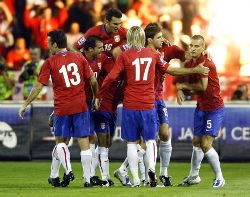 Serbian players unite in celebration during a 2010 World Cup qualifier.