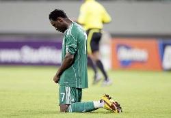 Nigeria's Obasi Ogbuke kneels down in disappointment after being defeated 3-1 by Egypt