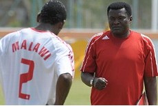 Malawi coach Kinnah Phiri giving instructions to one of his players during training.