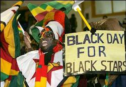 Opposite fans from Zimbabwe mock Ghana during match-day three at the 2006 African Nations Cup in Egypt.