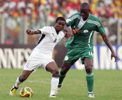 Ghana's Anthony Annan in a challenge with a Nigerian player