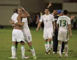 Algerian players celebrating their passage into the 2010 Africa Cup of Nations semis.