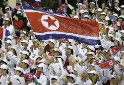 Korea DPR, the flag held by the people