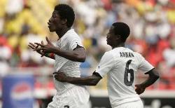 Ghana's Asamoah Gyan celebrates with Anthony Annan after scoring against Nigeria.