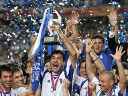 Greece players celebrate on the podium as they are crowned 2004 European Champions.