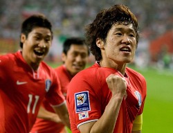South Korea's players celebrate after scoring a 2010 World Cup qualifier goal against Iran.