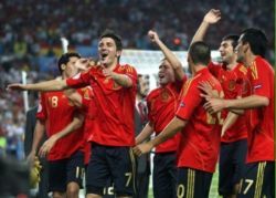 Spain's national football team celebrating after a goal scored by David Villa
