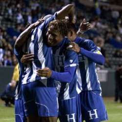 Honduras players unite in celebration.