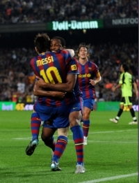 Lionel Messi of Barcelona celebrating with Seydou Keita after scoring a goal against Real Zaragoza