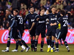 Real Madrid players celebrating Cristiano Ronaldo's free-kick against Real Valladolid.