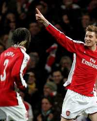 Bendtner celebrates with Arsenal