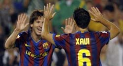 Messi and Xavi celebrate another goal