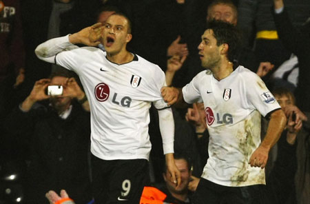 Fulham's on-form striker Bobby Zamora (left). Is it an England call up he hears? 