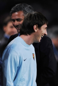 Inter Milan coach laughing with Barcelona ace Lionel Messi
during the Champions League game in Italy