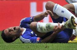 Germany and Chelsea midfielder Michael Ballack screams in pain after being tackled by Ghana and Portsmouth's Kevin Prince Boateng.