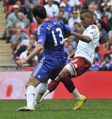Ghana and Portsmouth midfielder Prince Boateng dreadfully tackling Germany and Chelsea midfielder Michael Ballack.