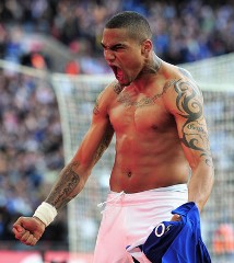 Ghana and Portsmouth's Kevin Prince Boateng celebrates shirtless after scoring a goal.