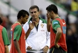 Portugal's Coach Carlos Queiroz monitoring his players during a training session. The picture sees Nani and Cristiano Ronaldo walking about.