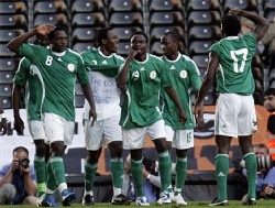 Nigerian players celebrating in style after scoring in a friendly match.