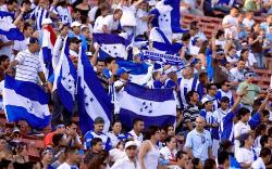 Honduras fans waving the country's flag.
