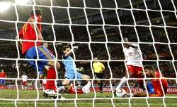 Switzerland's Blaise Kufo scores a goal past Iker Casillas.