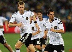 Germany's national football players running their way onto the pitch for their match against Australia.
