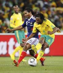 France's Florent Malouda vies with Macbeth Sibaya of South Africa.