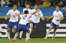 Korea Republic players celebrate as they score again against Nigeria.