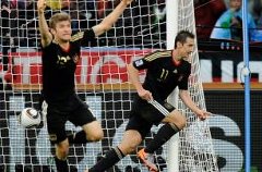 Thomas Muller, left, celebrates his opening goal against Argentina