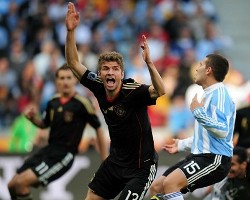 Germany's Thomas Muller celebrates his early goal against Argentina.